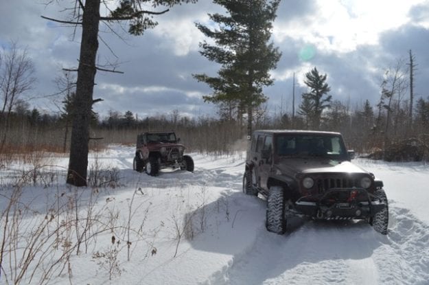 two jeeps in the snow
