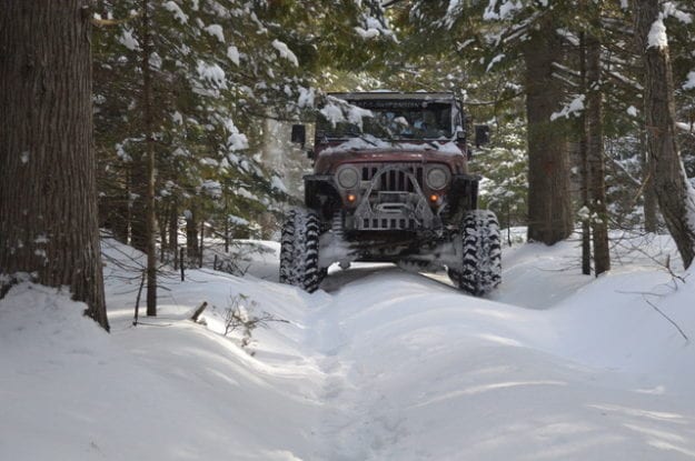 black jeep in the snowy forest