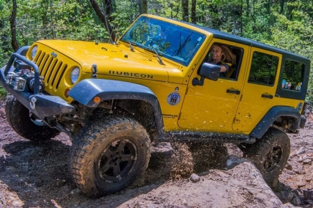 woman in yellow jeep