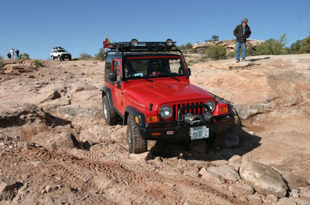 red jeep at arch canyon
