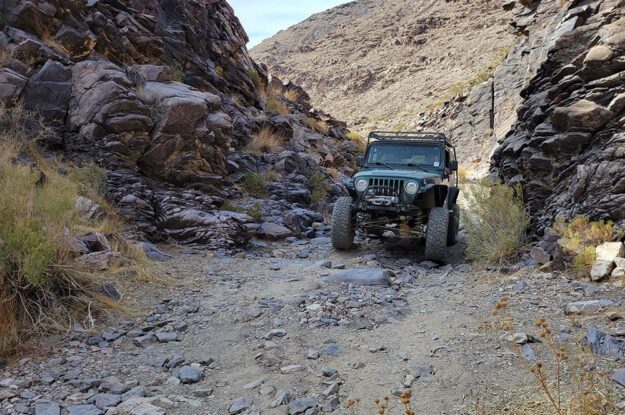 jeep between rocks in death valley