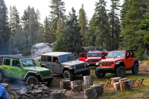 jeeps around a campfire