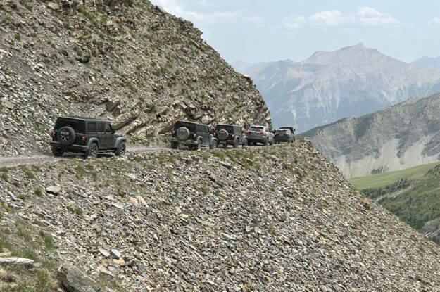 row of jeeps in the alps