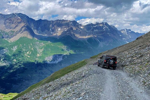 black jeep with mountains in background