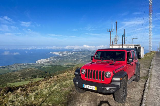 red jeep with view of ocean