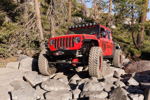 Jeep Gladiator up on rocks.
