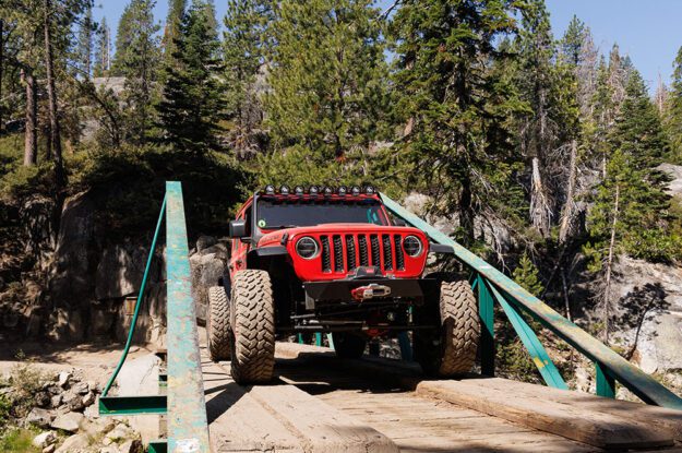 Front view of Jeep Gladiator crossing old bridge.