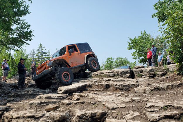 orange jeep starting downhill