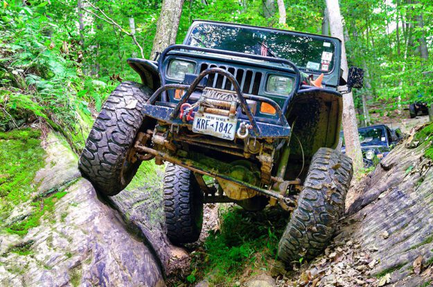 jeep going over rocks