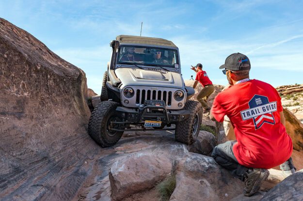 Trail guides and Jeep in technical section.