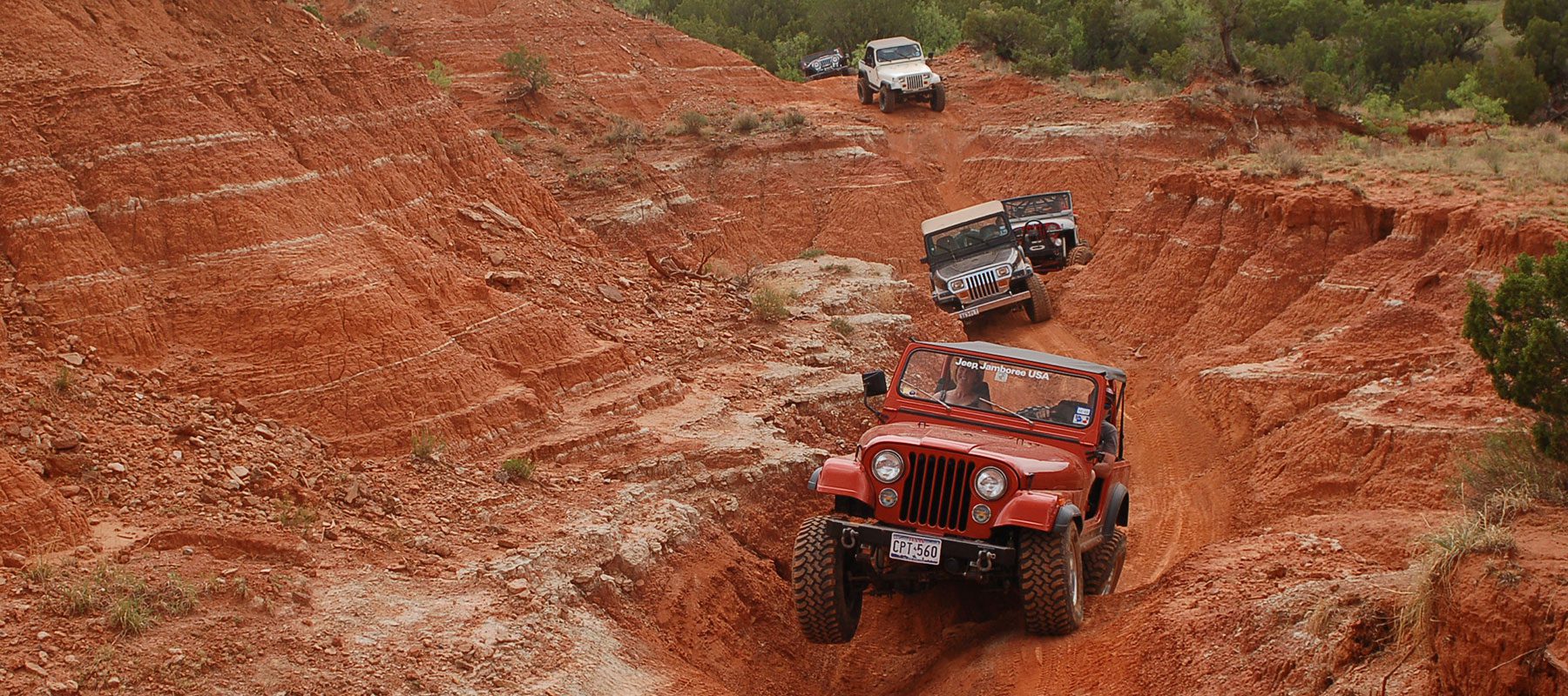 red jeep leads the way