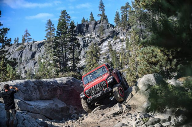 Tilted Jeep coming dwon rocky section.