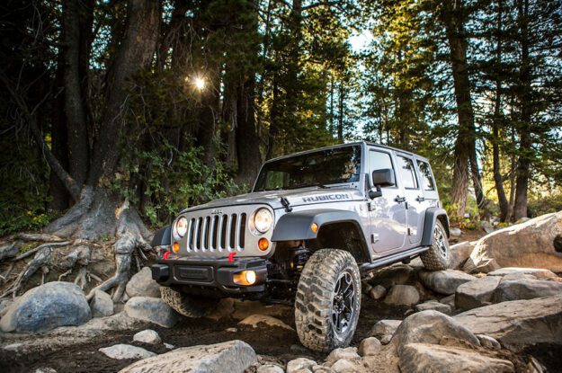 Silver Jeep on rocky section of trail.