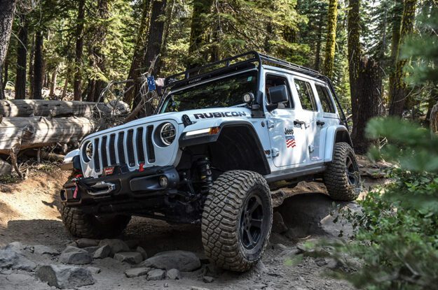 White Rubicon Jeep on the trail.