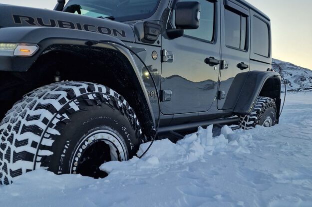 black jeep in deep snow