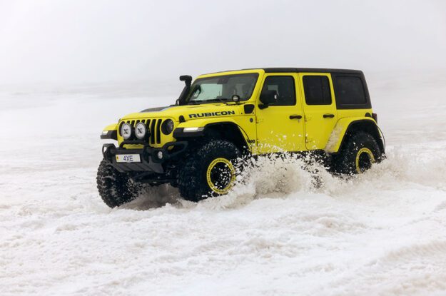 yellow jeep in the snow
