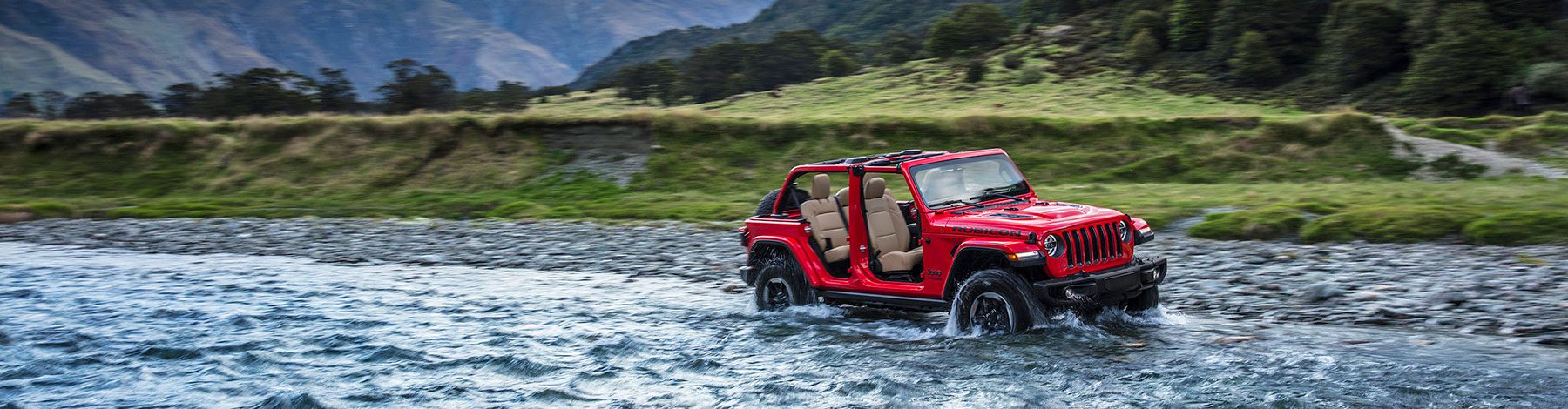 red jeep in stream