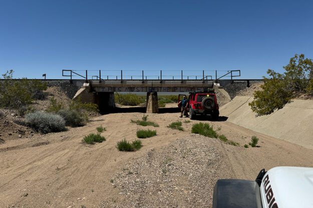 jeeps going through underpass