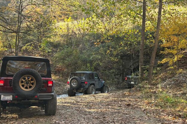 jeeps approaching tunnel