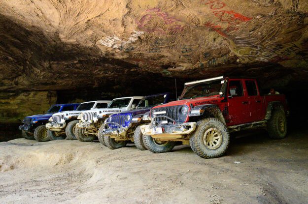 Jeeps parked in a cave