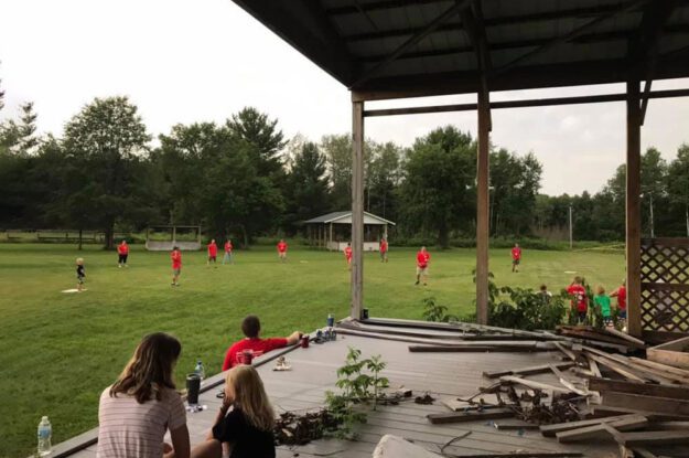 People playing wiffle ball