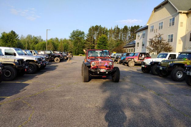 Jeep driving in parking lot
