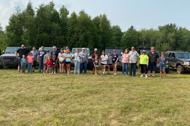 People in front of jeeps