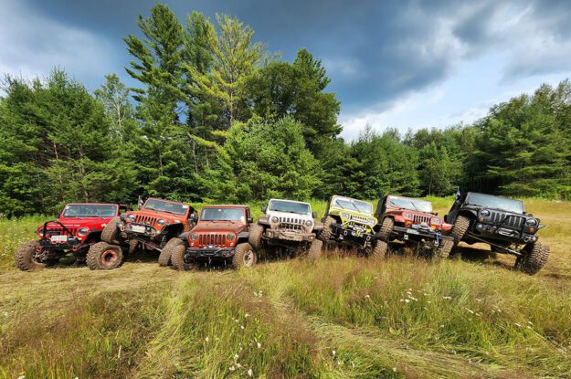 Jeeps parked on each others front tire