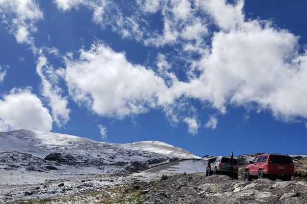 Jeeps and sky wtih clouds