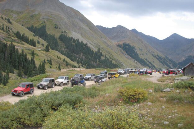 Jeeps parked on a pass