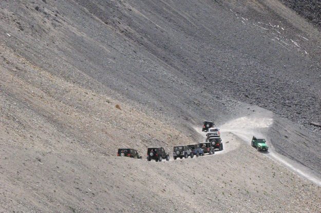 Jeeps approaching a switchback