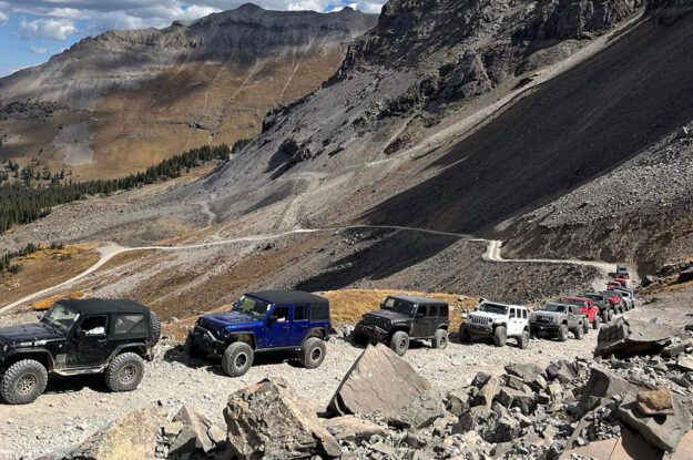 Jeeps lined up a road