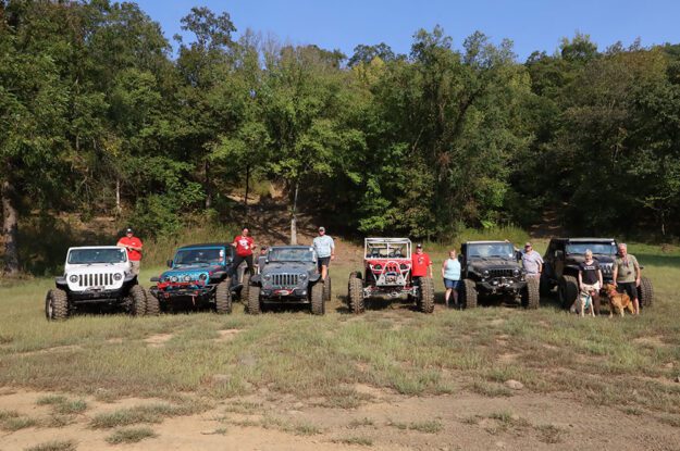 group of friend with jeeps