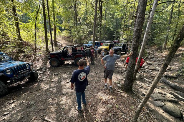 group jeeps in woods