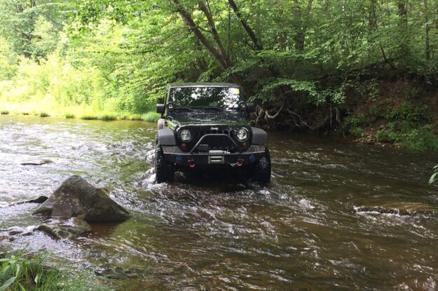 jeep in a stream