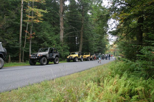 jeeps waiting along roadside