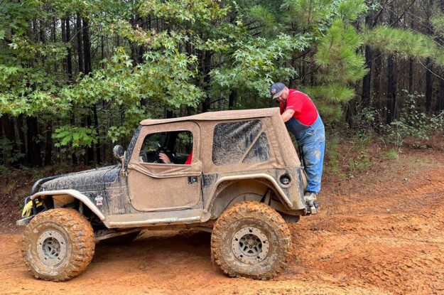 trail guide standing on bumper
