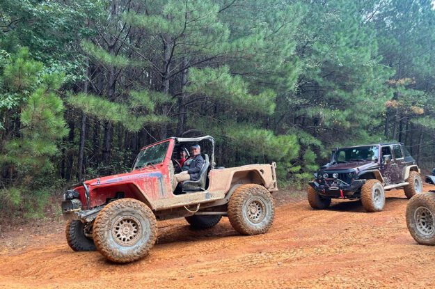 smiling people red jeep