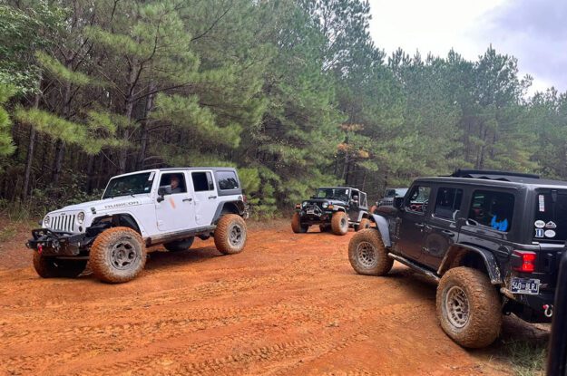 group of jeeps in red dirt