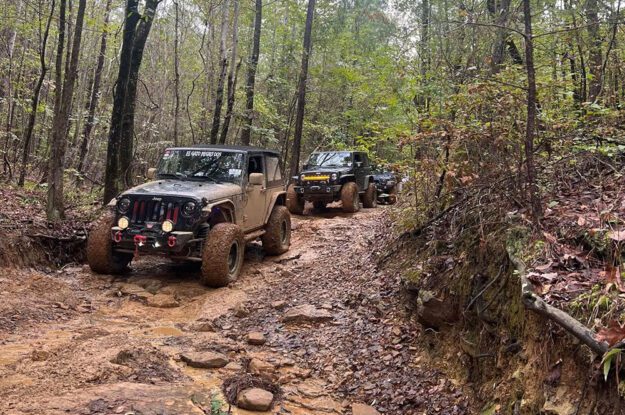 two jeeps on rocky terrain