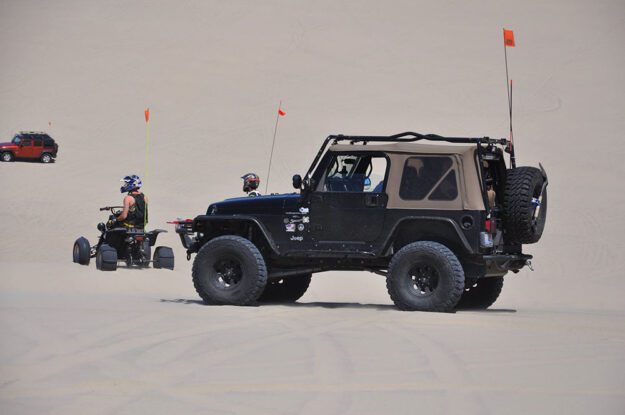 Jeeps and off-road vehicles on sand