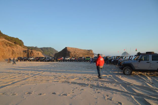 Jeeps parked on the beach