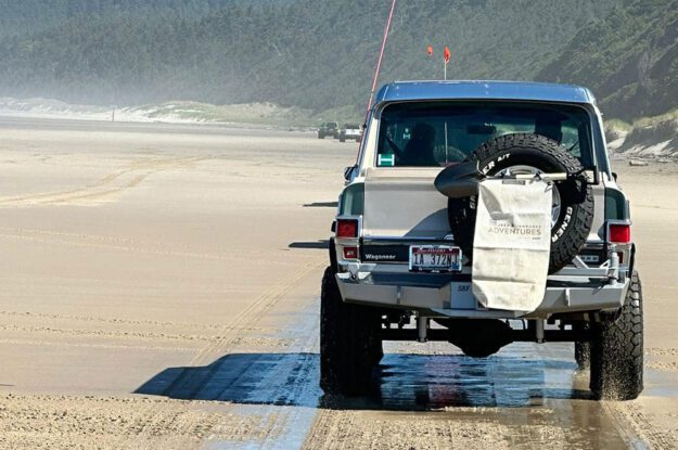 Jeep on wet sand