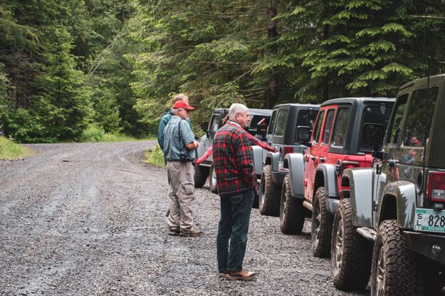 Jeeps on side of gravel road