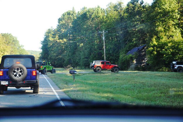 red jeep taking a turn