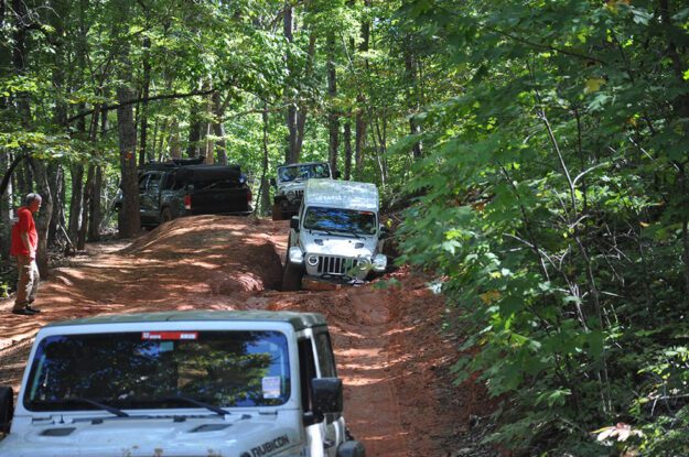 jeeps going through a gully