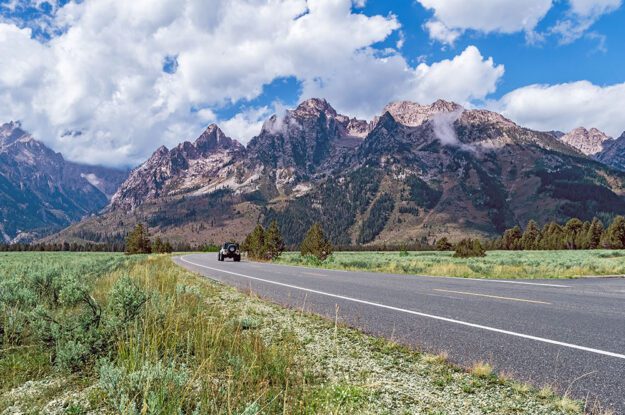 jeep driving on mountain road